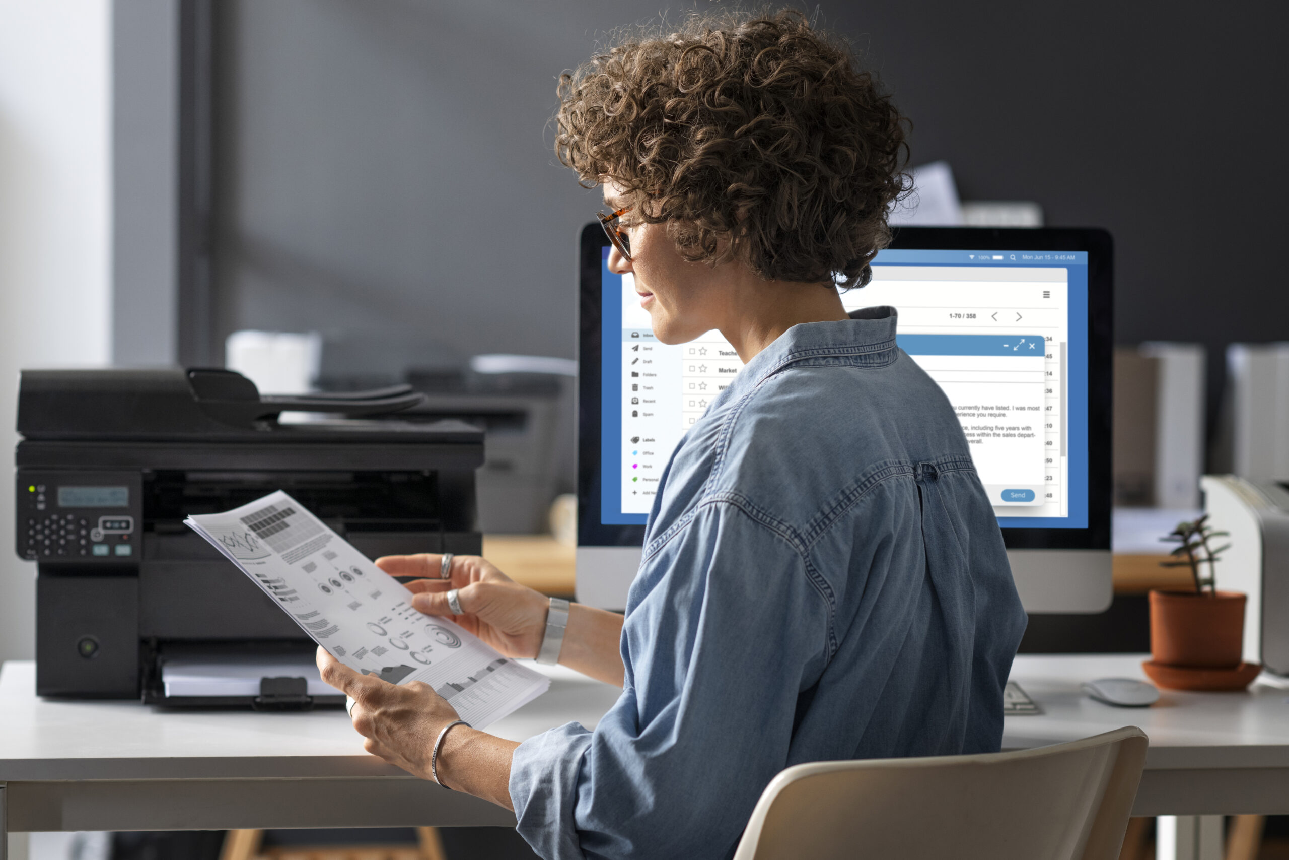 woman-sitting-desk-medium-shot-scaled.jpg